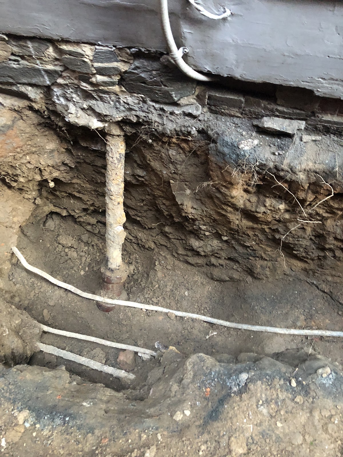 Cast iron supply pipe during water line repair